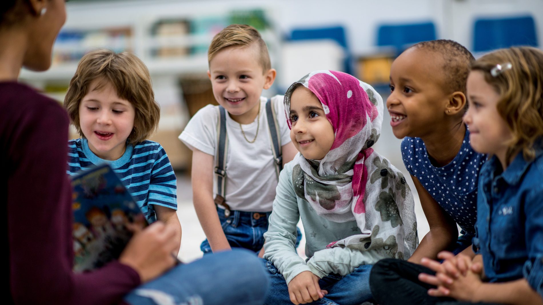 Smiling children listening to story