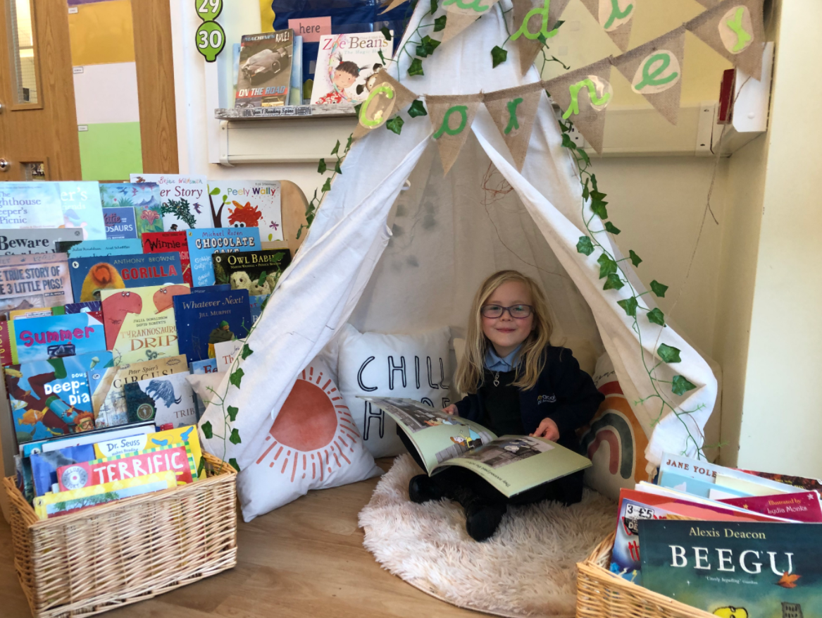 Pupil concentrating on writing Yew Tree Community School