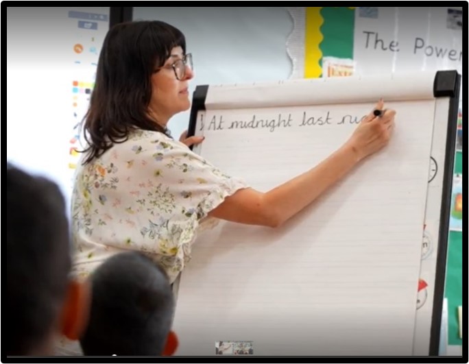 Pupil concentrating on writing Yew Tree Community School