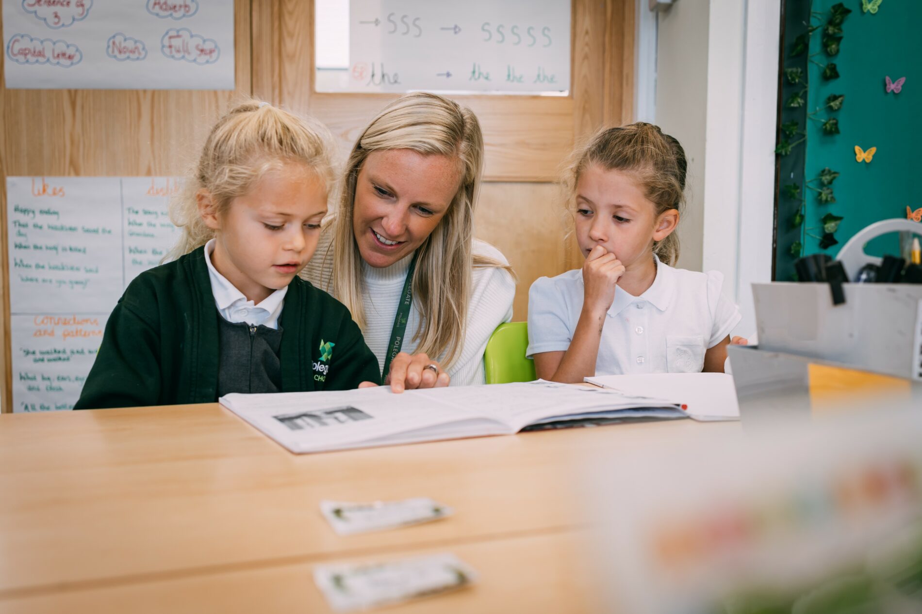 3 pupils writing Burnley Brow Community School